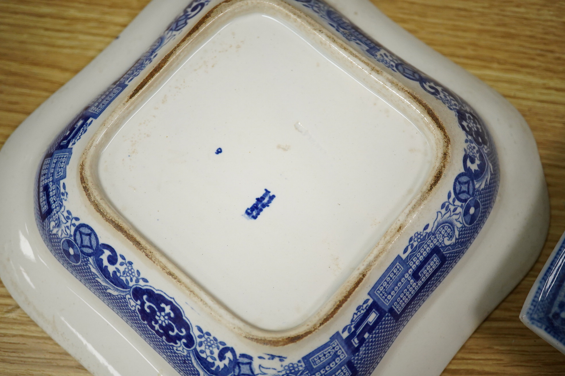 A quantity of Victorian blue and white pottery and a large Worcester jug, meat platters 45cm wide